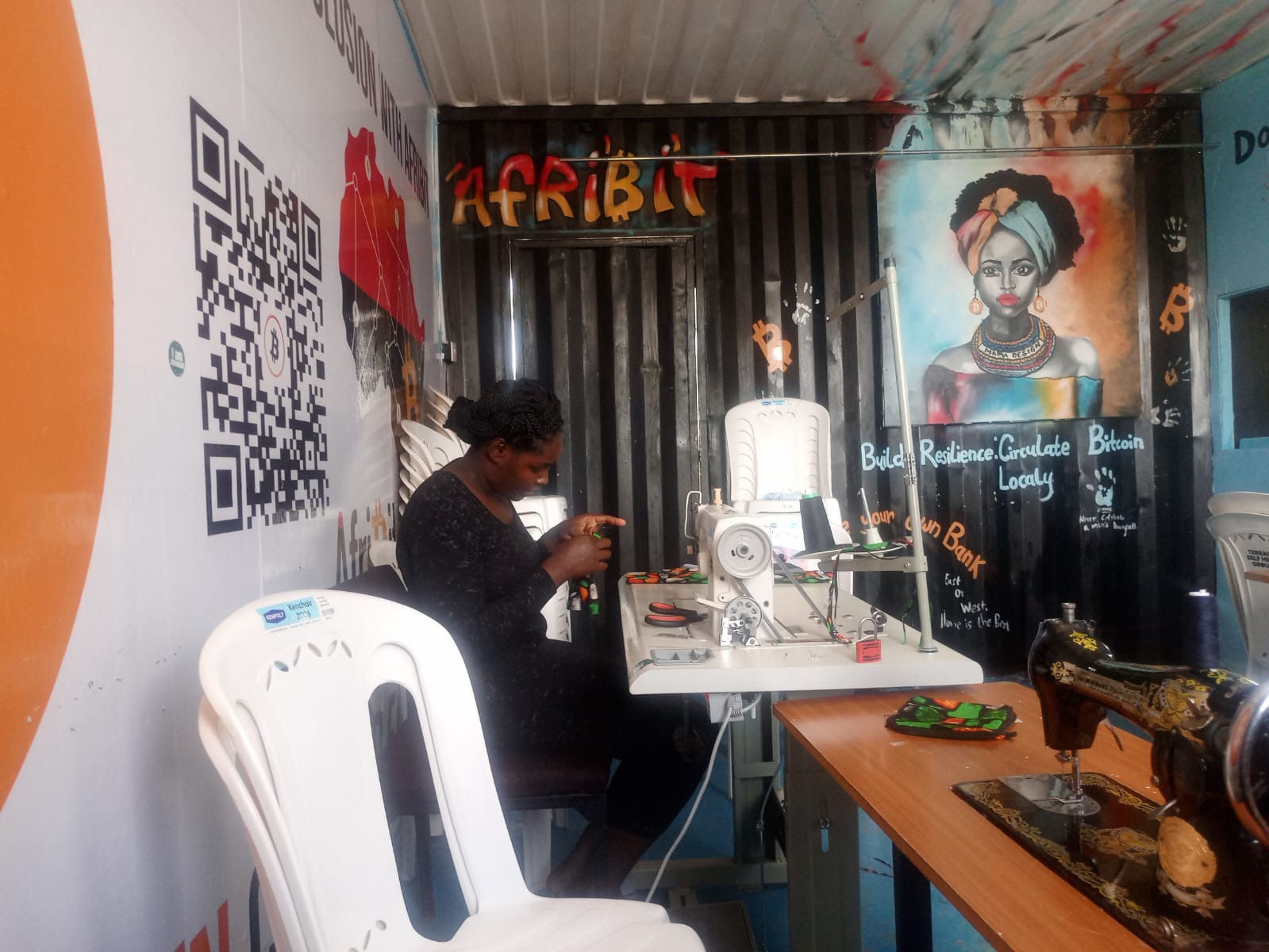 A worker handling fabric in a Kenyan sewing studio, one example of a real working environment for data collection.